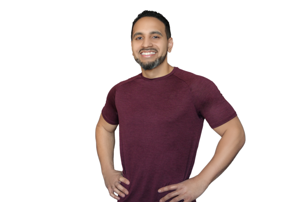 Pete Cataldo, minimalist fitness coach, smiling in a maroon t-shirt against a plain background